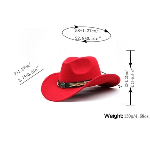 Red western cowboy hat with cattle emblem and black decorative band on white background