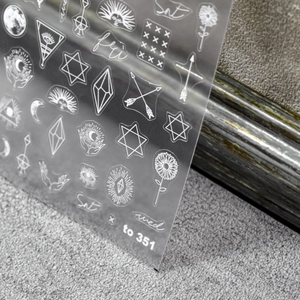 Detail view of 5D celestial nail art stickers with moon phases and stars on clear film