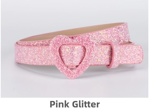Detail of pink glitter children's belt featuring a polished heart-shaped pin buckle