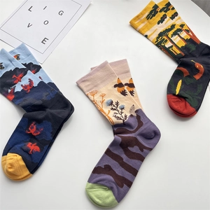 Artistic graffiti cotton mid-tube socks with vibrant blue, purple, and yellow patterns
