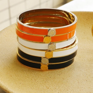 Elegant Roman numeral bangles in black white and orange enamel stainless steel finish