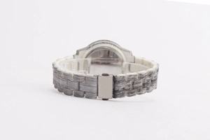 Detail view of the textured grey and white strap and silver metal buckle on the watch