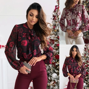Elegante camicetta a fiori da donna con scollo a fiocco e maniche a lanterna lunghe.