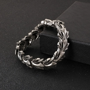 Mens vintage stainless steel dragon bone chain bracelet with flame scale design on black box