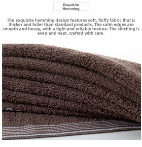 Detail shot of brown thick cotton towel with reinforced satin borders and dense loops