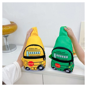 Detail of school bus chest bag showing school bus print and yellow canvas material