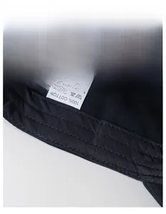 Detail of 100% cotton sweatband inside black baseball cap with embroidery