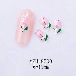 Macro shot of 6x11mm pink tulip nail charms with silver alloy and oil dripping detail