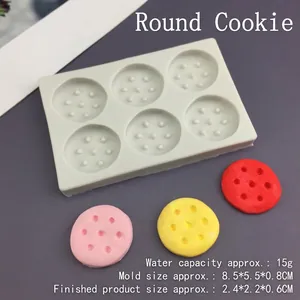 Detail of round cookie silicone mold showing six cavities and finished dessert samples