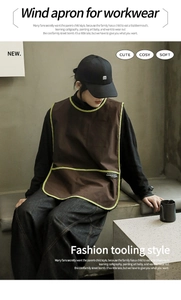 Workwear apron in brown canvas with fluorescent green trim and large front pocket detail