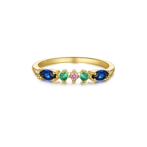 Close-up of gold-plated silver ring featuring five colorful marquise and round gemstones