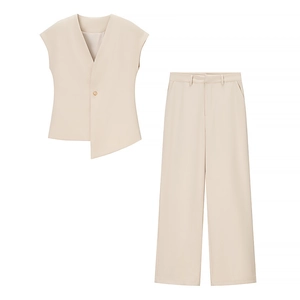 Detailed view of beige two-piece suit with V-neck sleeveless vest and straight trousers
