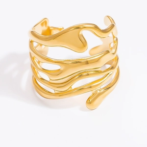 Macro detail of chunky 18k gold plated stainless steel ring with organic lava texture