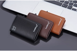 Close-up of litchi pattern leather wallet with RFID blocking and pop-up card mechanism