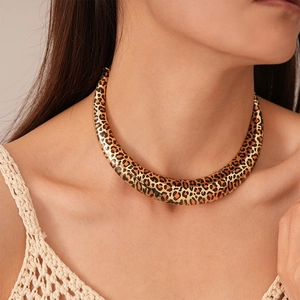 Statement U-shaped leopard print metal choker necklace with a polished gold finish