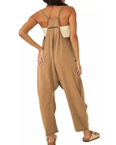 Detail view of khaki overall jumpsuits featuring a back zipper pocket and loose fit silhouette