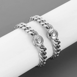 Detailed view of 10mm silver Cuban chain featuring polished and paved rhinestone clasps