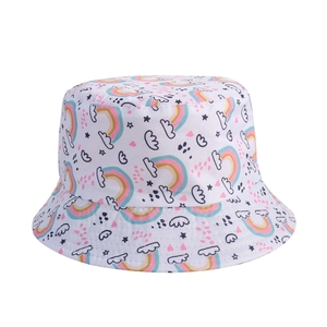 Close-up of children's white bucket hat with colorful rainbow and star patterns