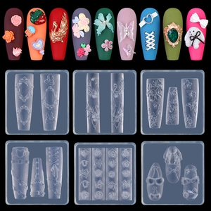 Detail of 3D silicone nail art molds featuring rose butterfly and lace patterns