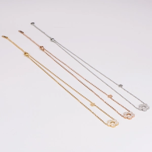 Sparkling diamond-encrusted flower pendant necklace in gold, rose gold, and silver finishes