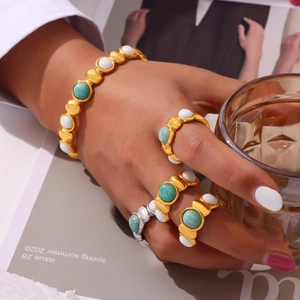 Titanium steel jewelry set with geometric natural stones and beads on model's hand