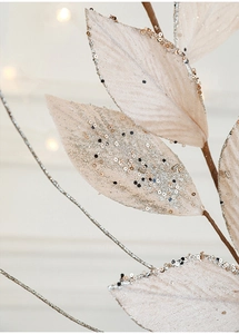 Macro shot of pink velvet artificial leaf with glitter and gold sequins for Christmas decor