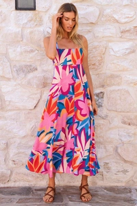 Detailed macro view of vibrant floral print and square neckline on a summer maxi dress