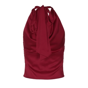 Close-up of red satin halter top featuring a delicate neck bow tie and silky fabric