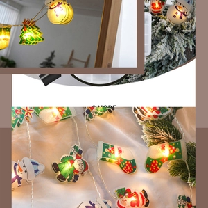 Détails macro de la guirlande LED de Noël avec bonhomme de neige et Père Noël