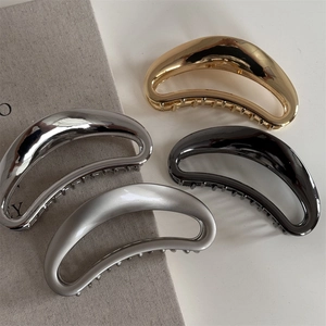 Set of four hollow crescent metal hair claws in gold, silver, gun black and matte finishes