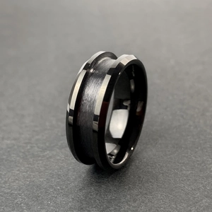 Close-up of black tungsten ring with brushed center and polished bevelled edges