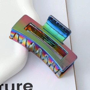 Hollow rectangle hair claw clip with metallic rainbow laser finish for elegant updo styles