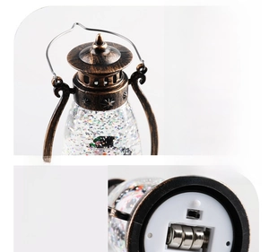 Detail view of the vintage bronze lantern base with power switch and battery compartment