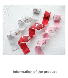 Detailed view of Christmas ribbons with glitter elk patterns and white fuzzy edges