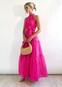 Detail view of pink plaid halter dress with waist bow tie and sheer grid texture fabric