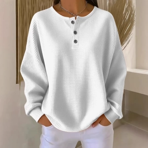White waffle knit long sleeve henley shirt with buttoned round neck for a relaxed fit