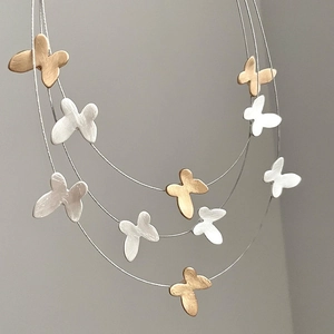 Three-layer butterfly tassel necklace in silver and gold frosted matte metal