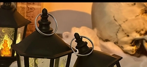 Close-up of the vintage black Halloween LED lantern handle and top ring detail