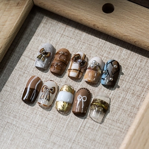 5D stereoscopic brown plaid press-on nails with 3D bows, pearls, and gold foil accents