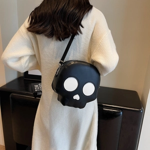 Funny skull crossbody bag with contrast design shown on a model in a modern interior