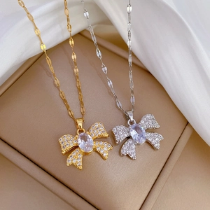 Titanium steel butterfly necklace set in gold and silver finish with crystal pavé