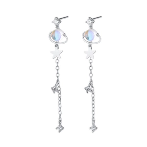 Elegant silver tassel drop earrings featuring celestial planet and star charms with crystals