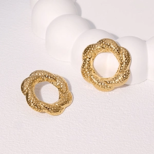 Textured floral hoop earrings in 18k gold plated stainless steel with hammered finish