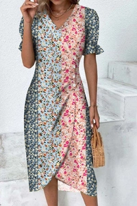 Detailed view of the patchwork floral summer dress featuring V-neck and side button accents