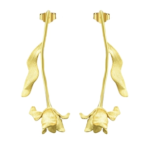 Detailed view of matte gold tulip earrings with long stems and brushed metal petals