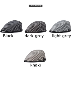 Detail showing vintage plaid beret hats in black, grey and khaki with metal side buckles