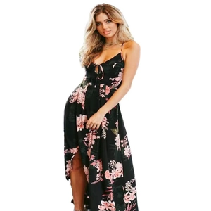 Detail of floral print on black spaghetti strap maxi dress with high side slit design