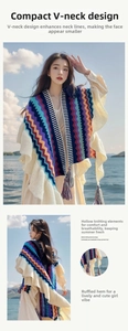 Detail of bohemian knit shawl with colorful wave patterns and elegant tassel hemline