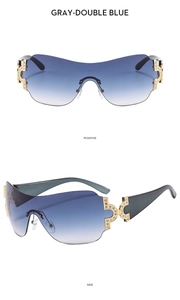 Close-up of Y2K rimless sunglasses with blue gradient lenses and rhinestone-encrusted hinges