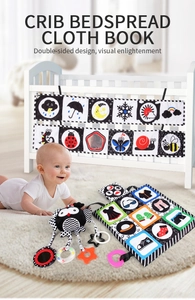 Infant cloth book set with high-contrast black and white patterns and owl crib hanging toy